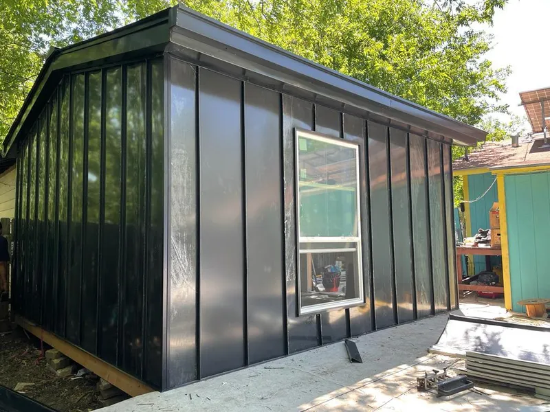 Black standing seam metal wall panels for Roof Inspection in San Juan Capistrano